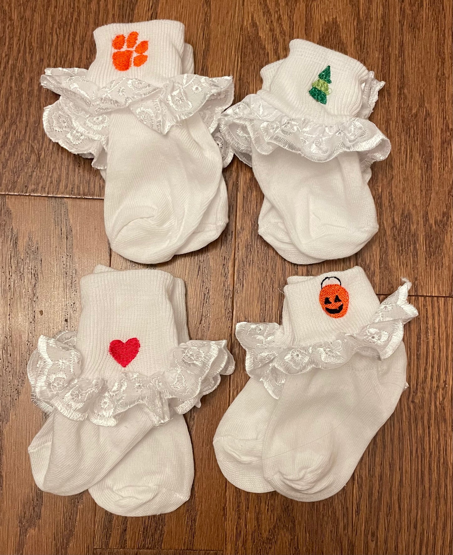 Four pair of monogrammed girl socks