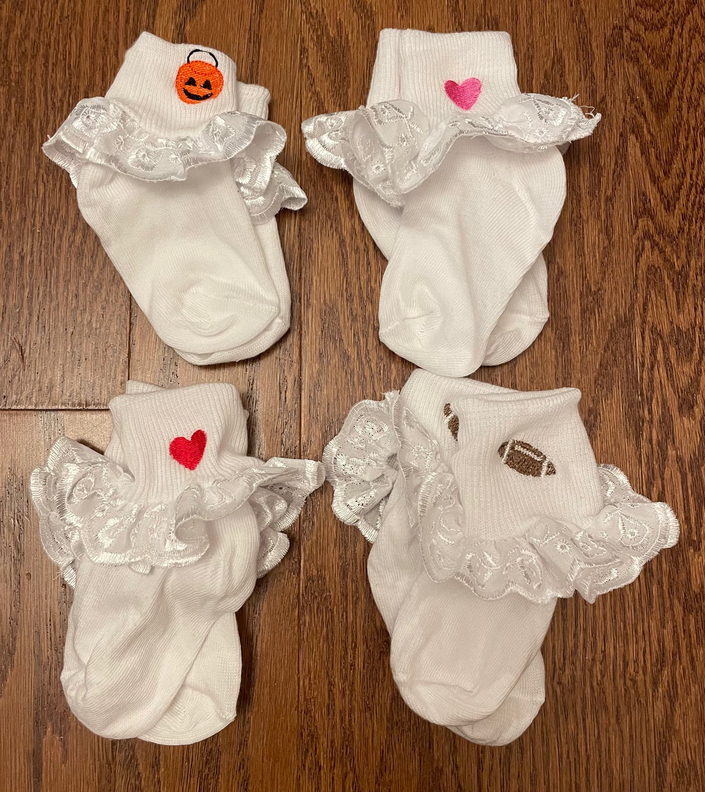 Four pair of monogrammed girl socks