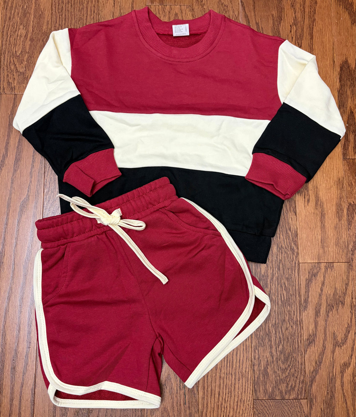 Garnet, black, and cream boy sweater short set